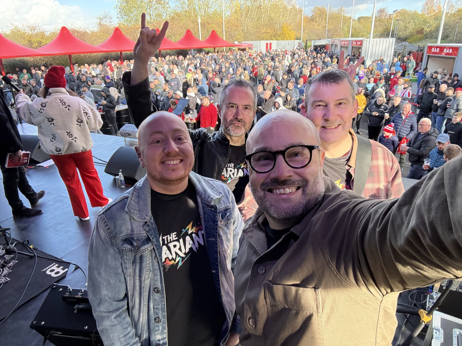 The Variants on stage together with a festival crowd behind them
